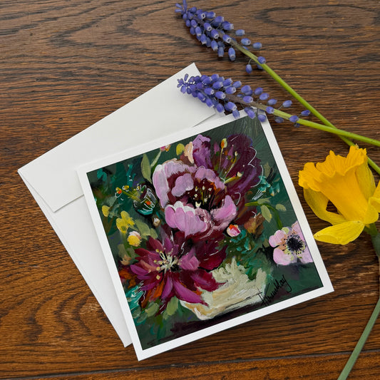floral greeting card of bouquet in a vase
on a dark background